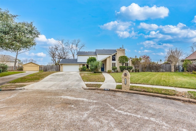 view of front facade featuring a garage and a front lawn