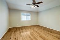 spare room with wood-type flooring