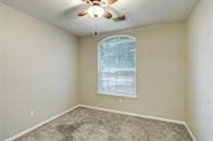 unfurnished room featuring carpet