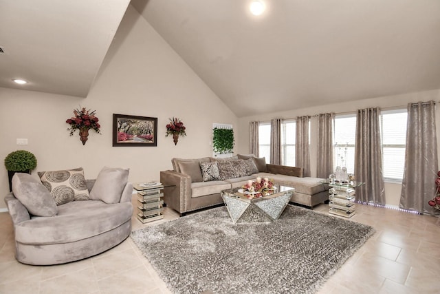 tiled living room featuring high vaulted ceiling