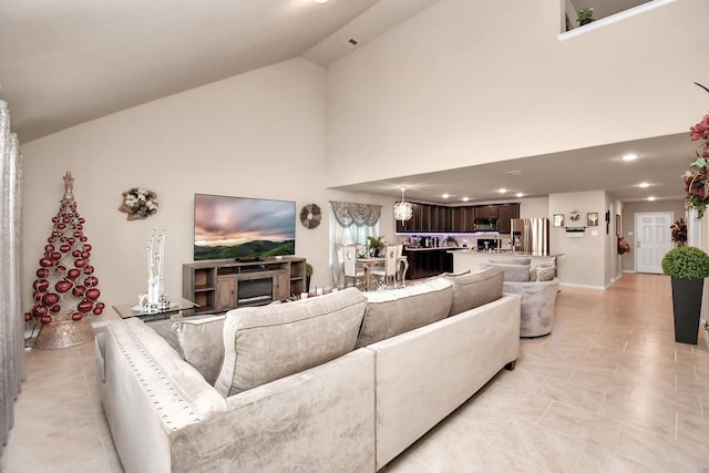 tiled living room with high vaulted ceiling