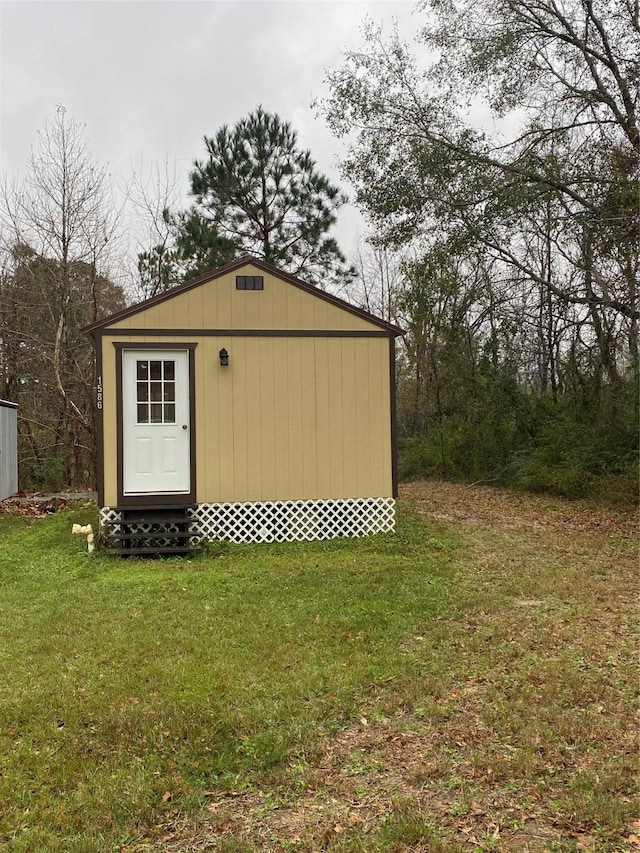 view of outdoor structure with a lawn