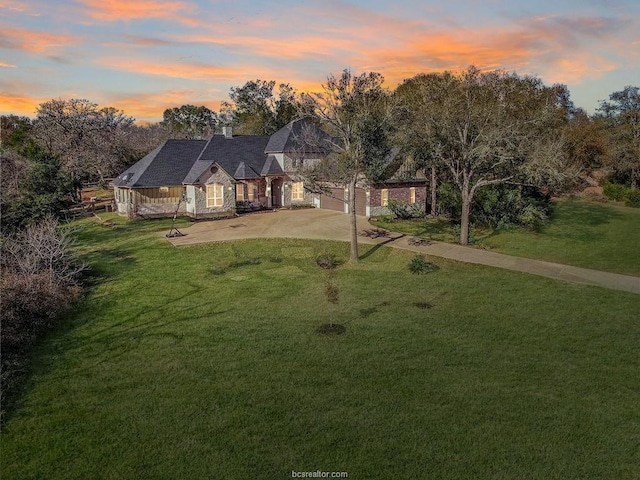 view of front of home featuring a lawn