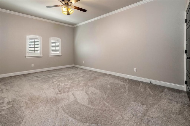 carpeted spare room with ceiling fan and ornamental molding