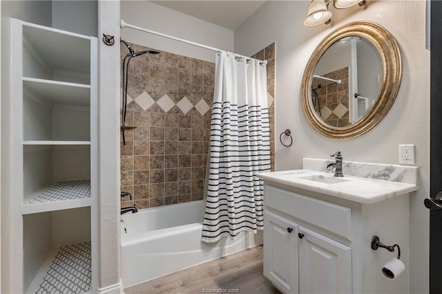 bathroom featuring hardwood / wood-style floors, vanity, and shower / tub combo with curtain