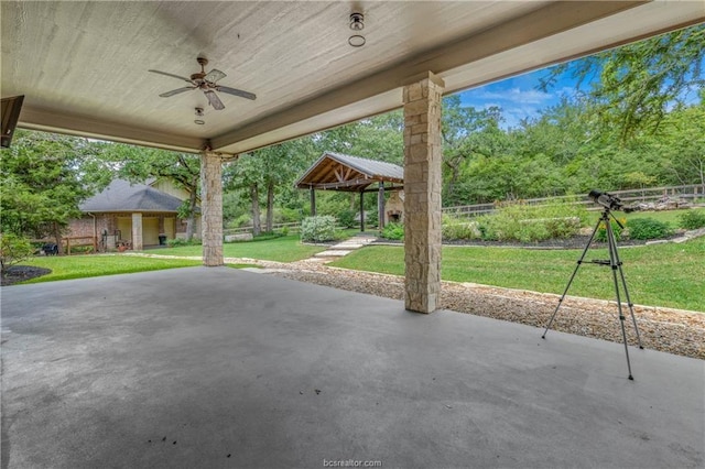 view of patio / terrace featuring a gazebo and ceiling fan