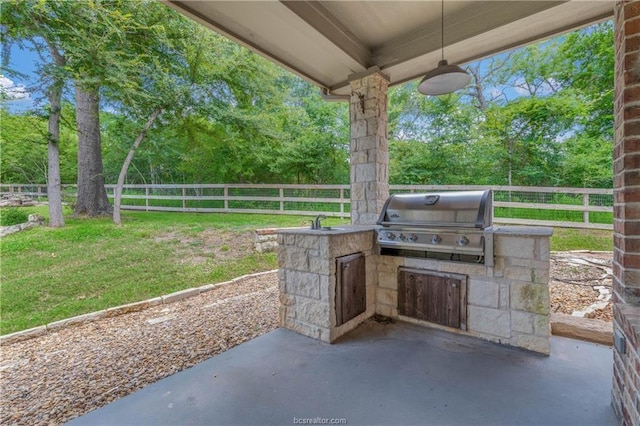 view of patio / terrace with sink, grilling area, and exterior kitchen