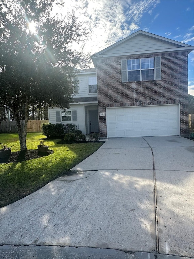 front facade featuring a front yard and a garage