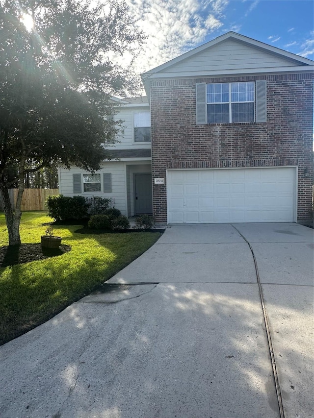 front facade featuring a front yard and a garage