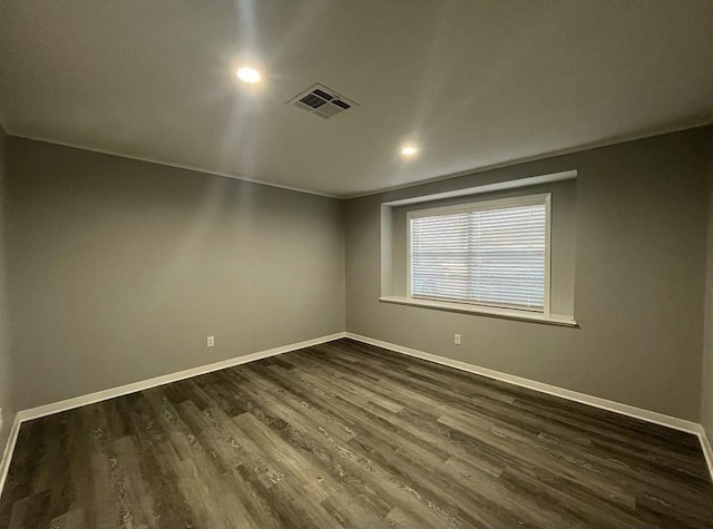 empty room featuring dark hardwood / wood-style floors