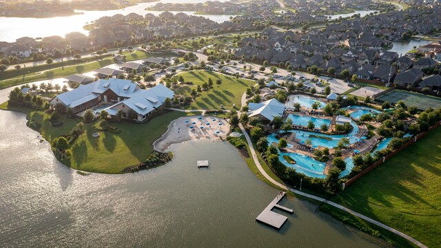 birds eye view of property with a residential view and a water view