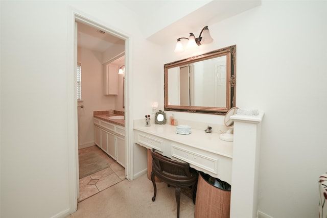 bathroom with tile patterned flooring and vanity