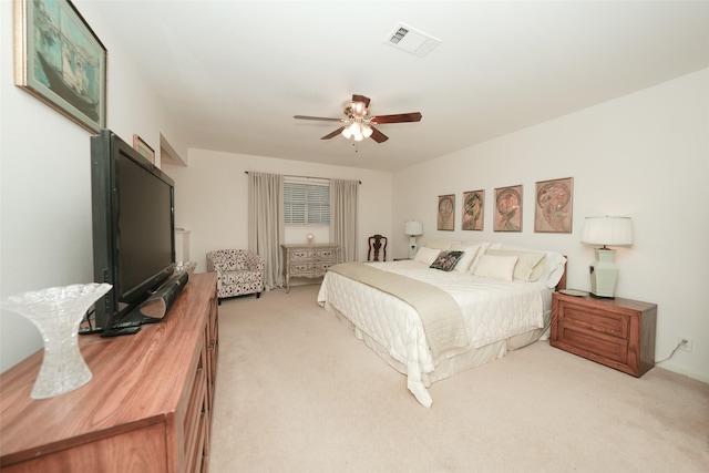 bedroom featuring ceiling fan and light carpet