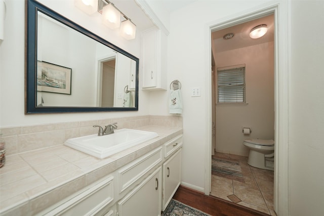 bathroom with vanity and toilet