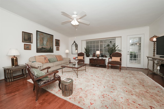 living room featuring ceiling fan, dark hardwood / wood-style floors, and ornamental molding