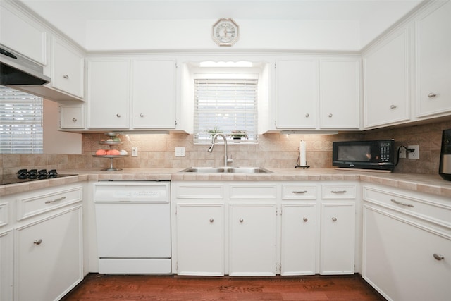 kitchen featuring white cabinets, sink, and black appliances