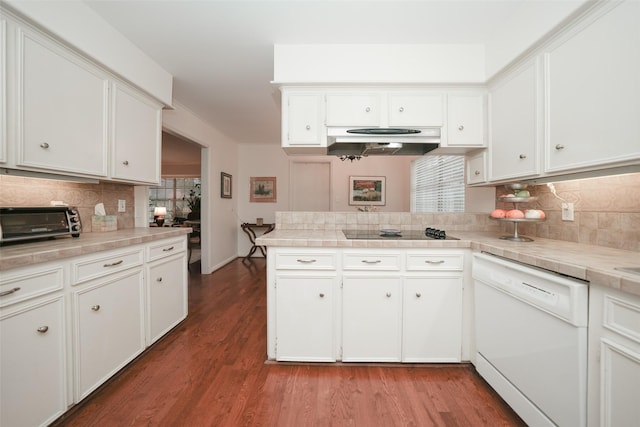 kitchen with white cabinets, kitchen peninsula, and white dishwasher