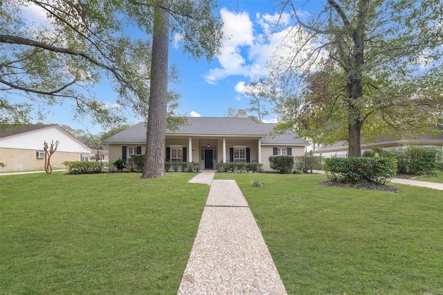 ranch-style home with a porch and a front yard