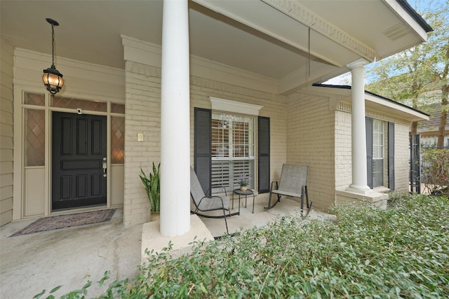 doorway to property featuring covered porch