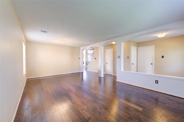 empty room featuring dark hardwood / wood-style flooring