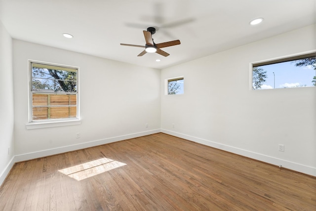 spare room with ceiling fan and hardwood / wood-style floors