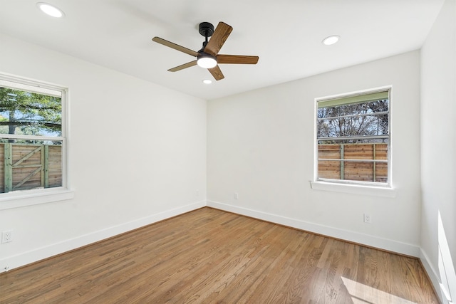 unfurnished room featuring light wood-type flooring and ceiling fan