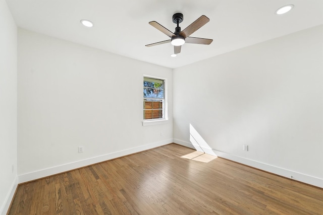 unfurnished room featuring ceiling fan and hardwood / wood-style floors