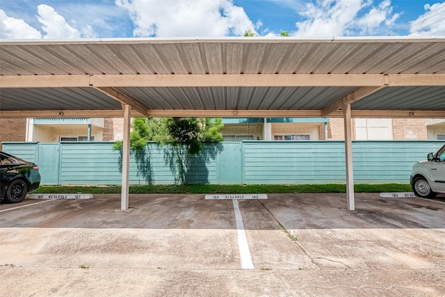 view of parking / parking lot with a carport