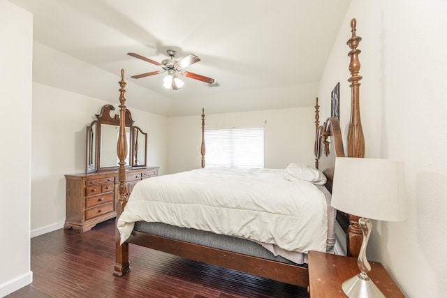 bedroom with dark hardwood / wood-style flooring, ceiling fan, and lofted ceiling