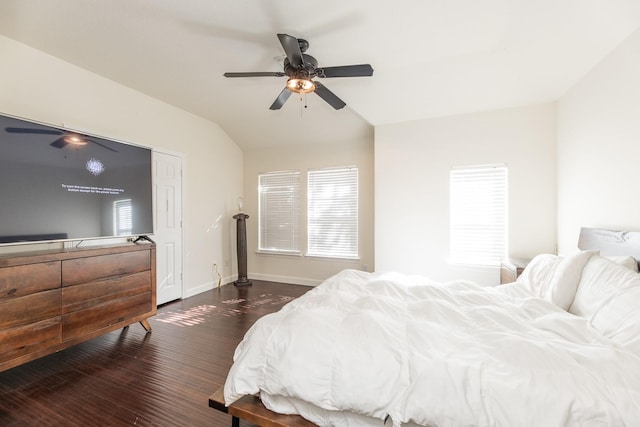 bedroom featuring vaulted ceiling, ceiling fan, and dark hardwood / wood-style floors