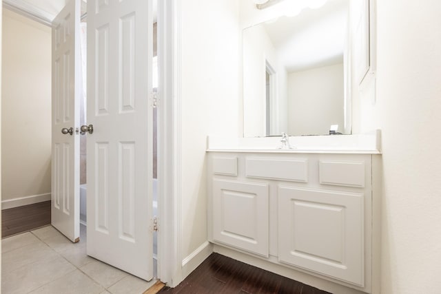 bathroom with tile patterned flooring and vanity