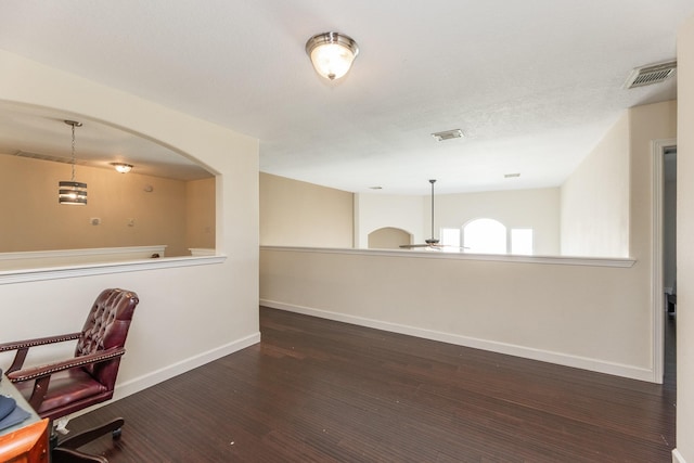 unfurnished office with dark hardwood / wood-style flooring