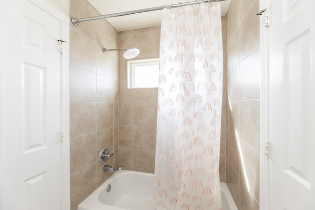 bathroom featuring shower / bath combo with shower curtain