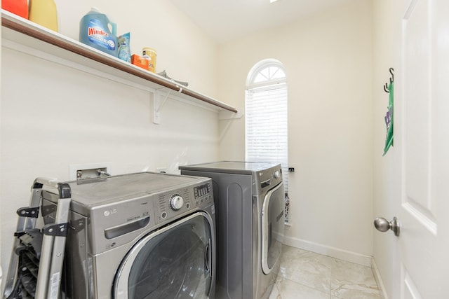 laundry area with separate washer and dryer