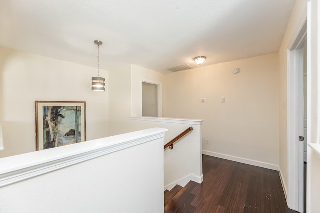 hall with dark hardwood / wood-style flooring