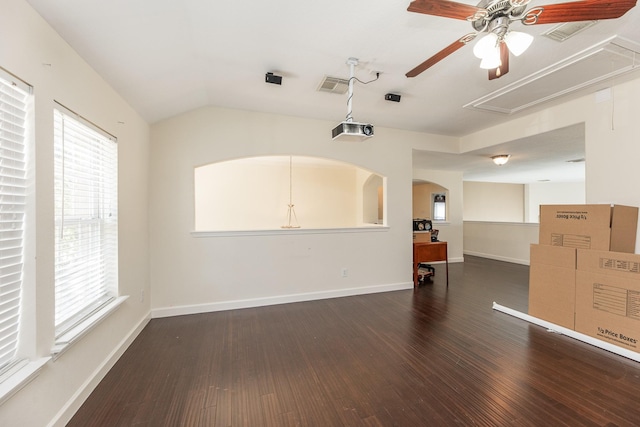 empty room featuring ceiling fan, dark wood-type flooring, and lofted ceiling