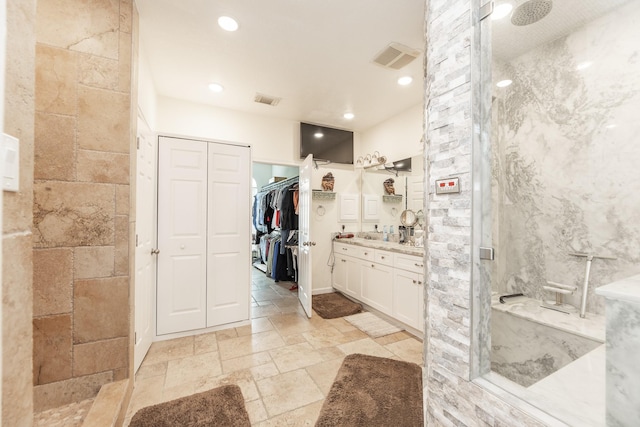 bathroom with vanity and walk in shower