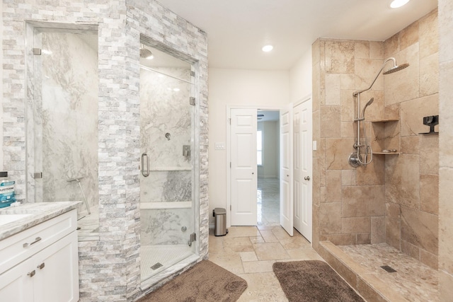 bathroom with vanity and a shower with shower door