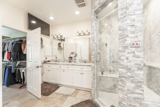 bathroom with vanity and walk in shower