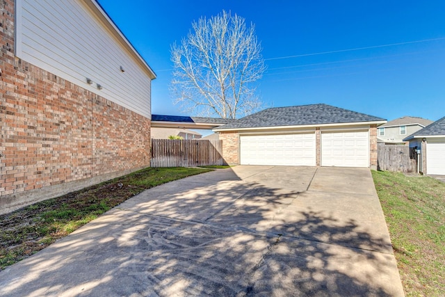 exterior space with an outbuilding and a garage