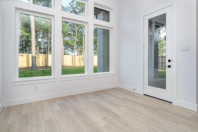 doorway to outside with light hardwood / wood-style floors