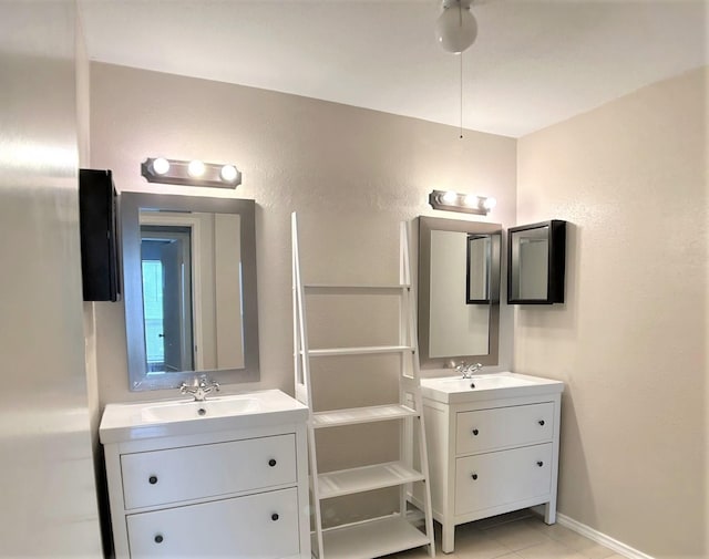 bathroom with tile patterned floors and vanity