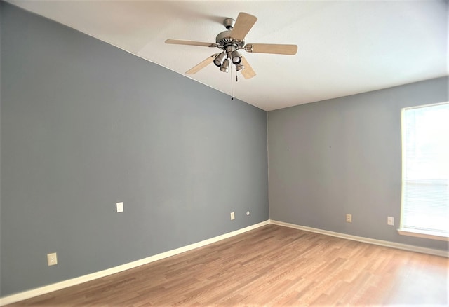 unfurnished room with ceiling fan and light wood-type flooring