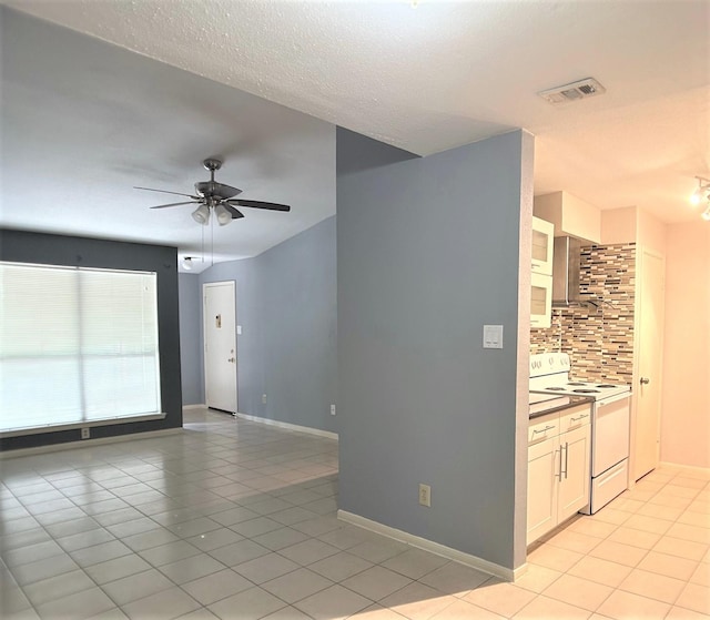 interior space featuring ceiling fan and light tile patterned flooring