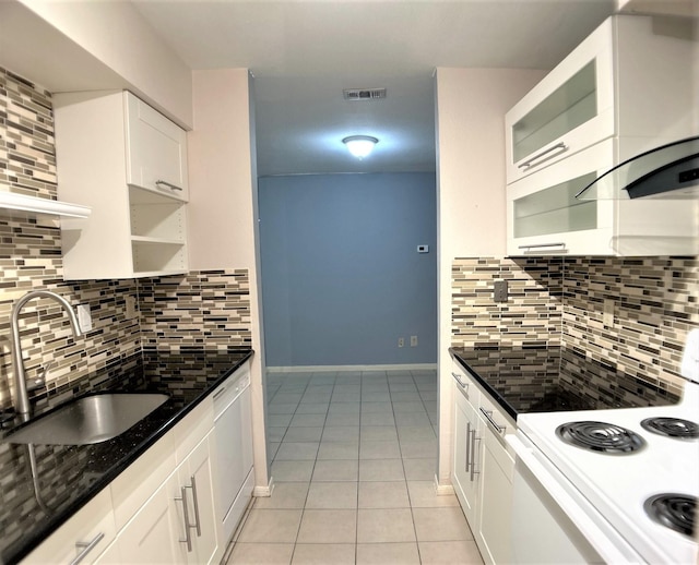 kitchen with stove, backsplash, white dishwasher, sink, and white cabinets