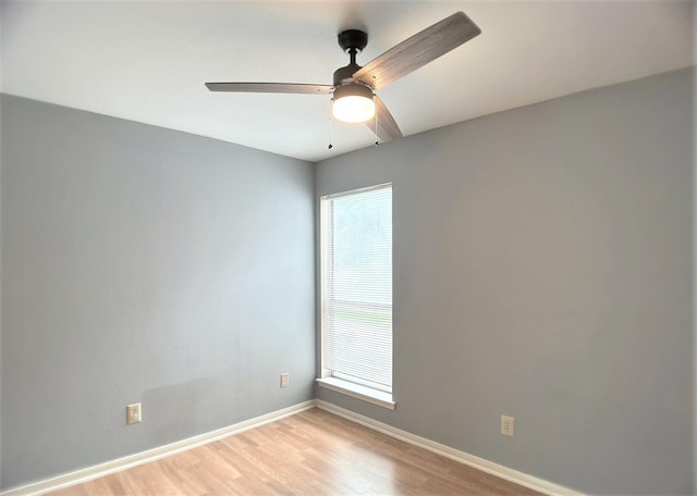 spare room featuring ceiling fan and light hardwood / wood-style floors