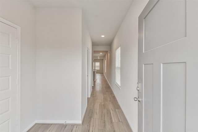 corridor featuring light hardwood / wood-style floors