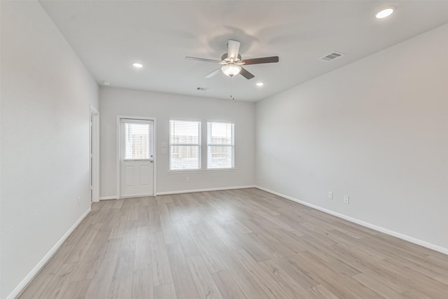 unfurnished room with light hardwood / wood-style flooring and ceiling fan