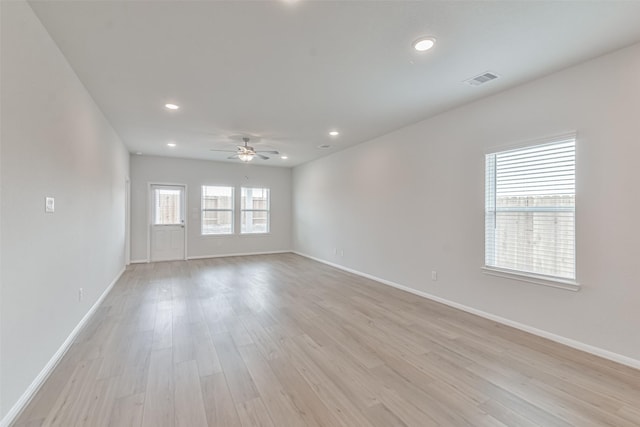 empty room featuring ceiling fan and light wood-type flooring