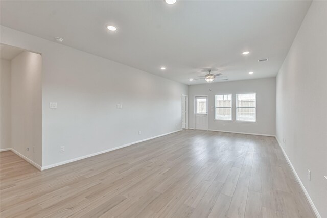 unfurnished room featuring ceiling fan and light hardwood / wood-style floors